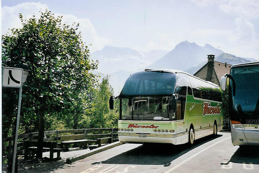 (062'636) - H�rzeler, Dietikon - Nr. 3/ZH 72'429 - Neoplan am 10. August 2003 in Adelboden, Landstrasse