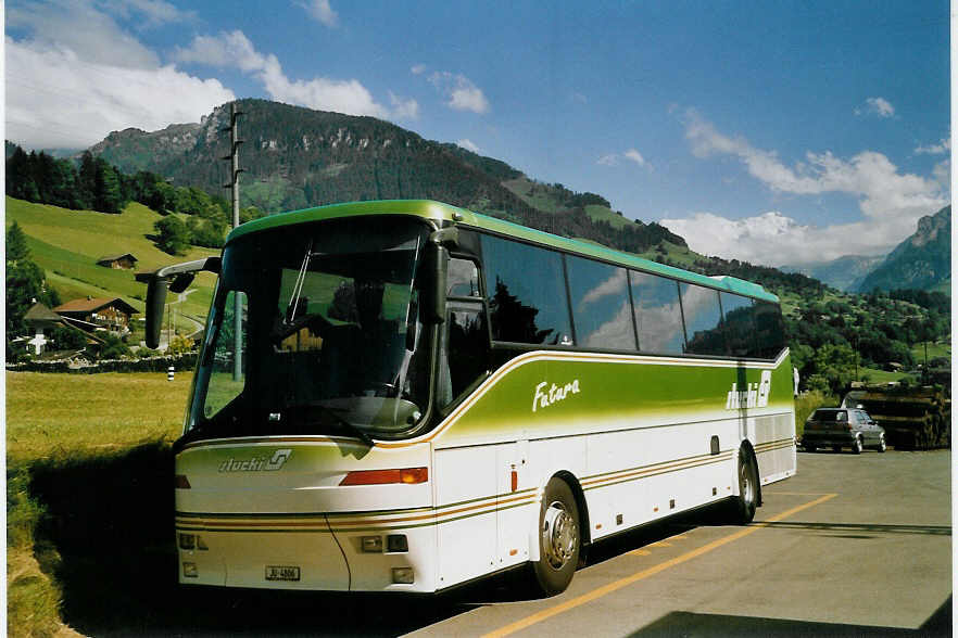 (068'813) - Stucki, Porrentruy - JU 4806 - Bova am 3. Juli 2004 beim Bahnhof M�lenen