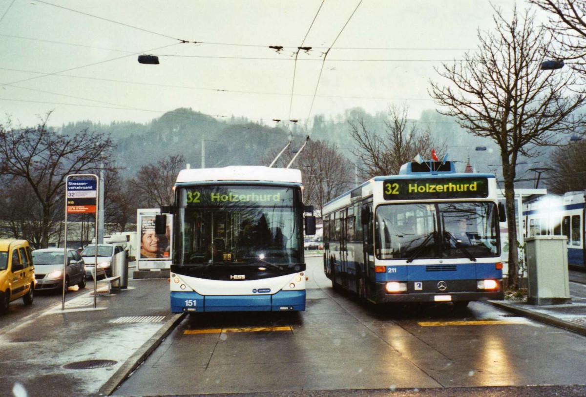 (123'014) - VBZ Z�rich - Nr. 151 - Hess/Hess Gelenktrolleybus + Nr. 211/ZH 588'211 - Mercedes am 13. Dezember 2009 in Z�rich, Strassenverkehrsamt