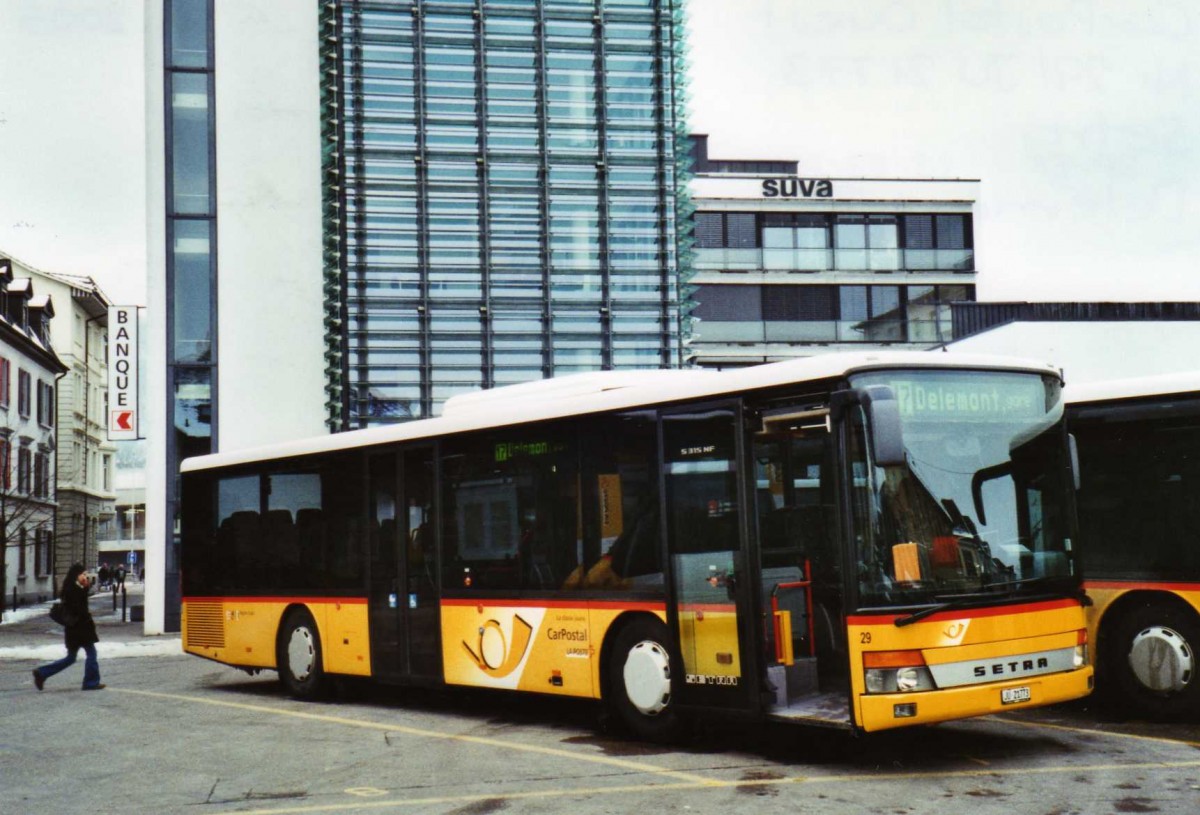 (124'431) - CarPostal Ouest - Nr. 29/JU 21'773 - Setra am 15. Februar 2010 beim Bahnhof Del�mont