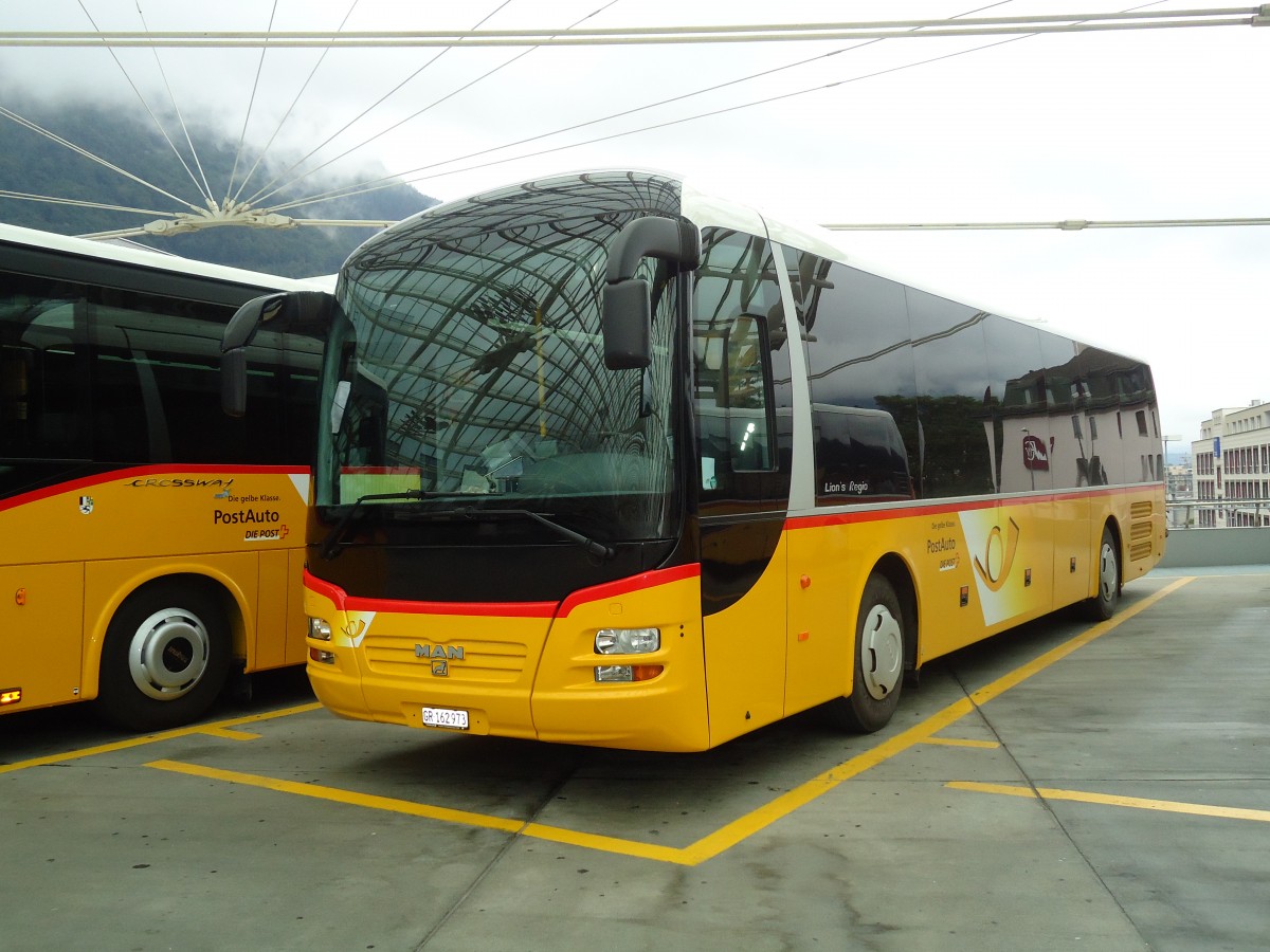 (128'700) - PostAuto Graub�nden - GR 162'973 - MAN am 13. August 2010 in Chur, Postautostation