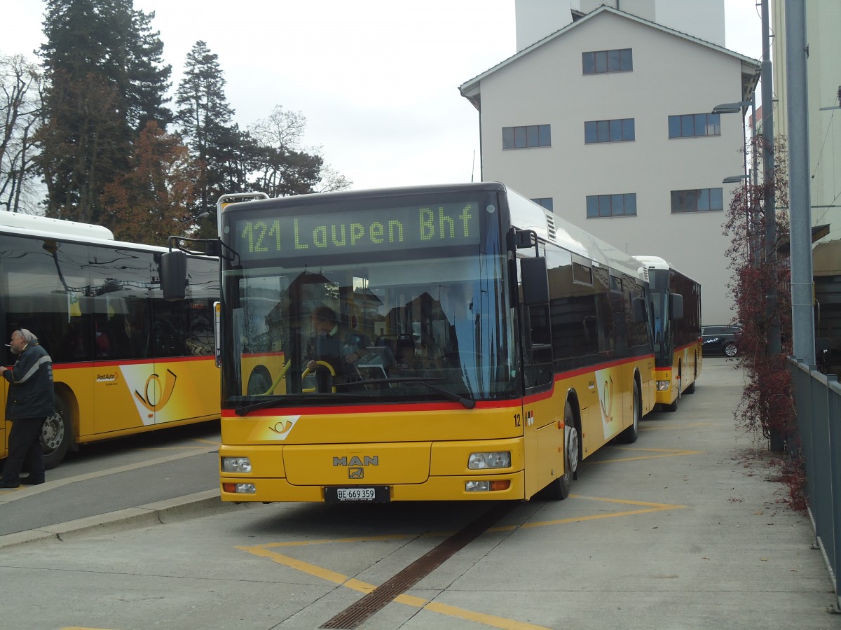 (148'165) - Klopfstein, Laupen - Nr. 12/BE 669'359 - MAN (ex STB Laupen Nr. 23) am 25. November 2013 beim Bahnhof D�dingen