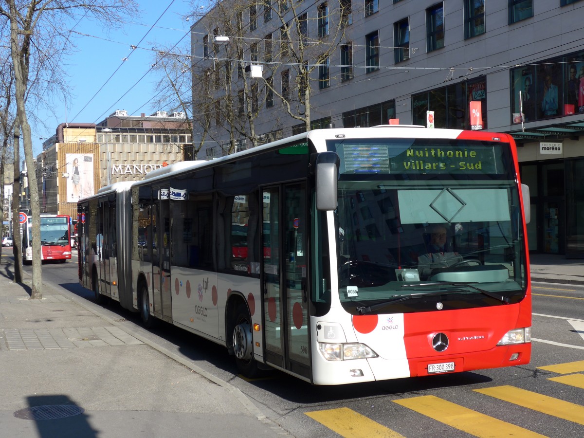 (149'278) - TPF Fribourg - Nr. 596/FR 300'398 - Mercedes am 9. M�rz 2014 beim Bahnhof Fribourg