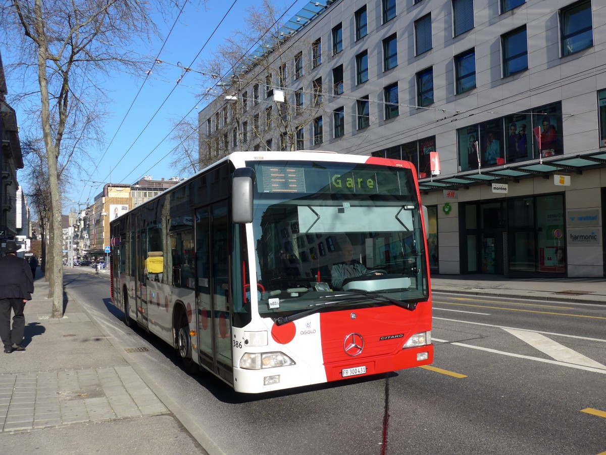 (149'286) - TPF Fribourg - Nr. 386/FR 300'431 - Mercedes am 9. M�rz 2014 beim Bahnhof Fribourg