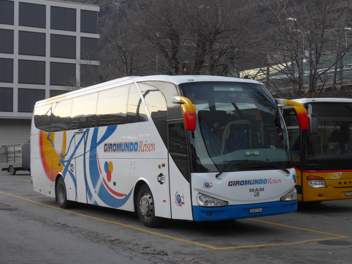(176'854) - Giromundo, Z�rich - ZH 691'924 - MAN/Atomic am 4. Dezember 2016 beim Bahnhof Brig
