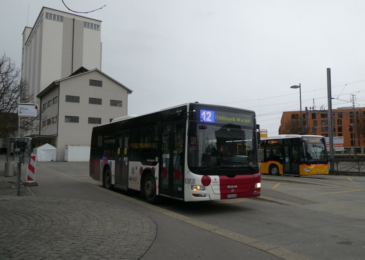 (232'733) - TPF Fribourg - Nr. 354/FR 300'405 - MAN/G�ppel am 6. Februar 2022 beim Bahnhof D�dingen