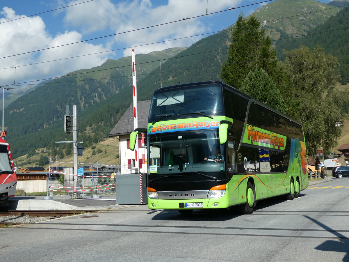 (238'376) - Aus Deutschland: H�rmann, Augsburg - Nr. 7002/A-HR 7002 - Setra am 24. Juli 2022 beim Bahnhof Ulrichen