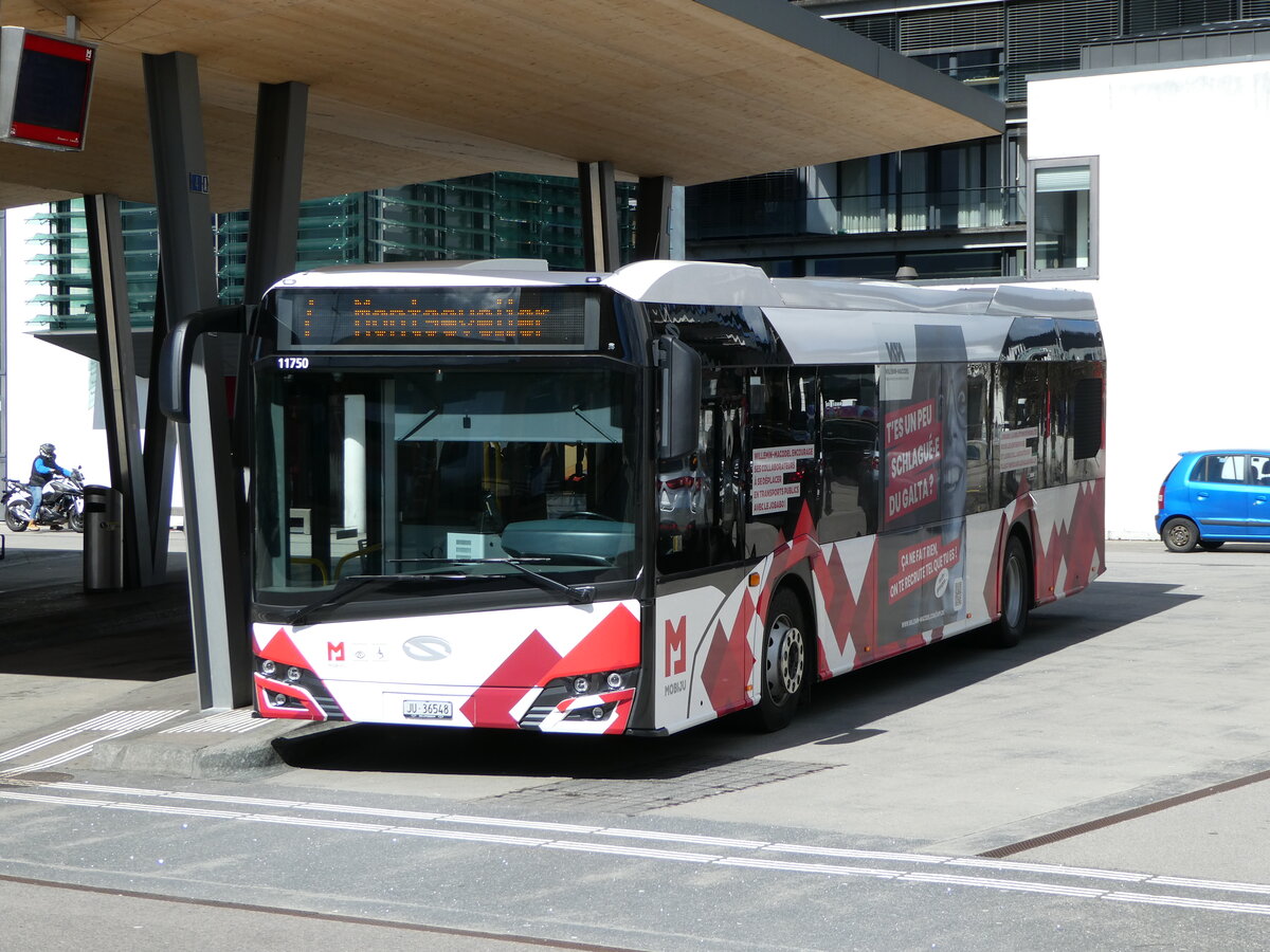 (247'622) - CarPostal Ouest - JU 36'548/PID 11'750 - Solaris am 25. M�rz 2023 beim Bahnhof Del�mont