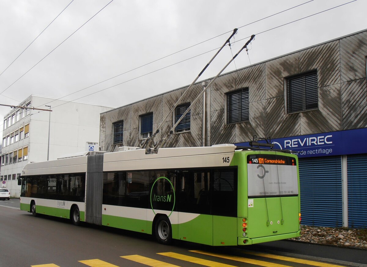 (257'554) - transN, La Chaux-de-Fonds - Nr. 145 - Hess/Hess Gelenktrolleybus (ex TN Neuch�tel Nr. 145) am 11. Dezember 2023 beim Bahnhof Marin-�pagnier