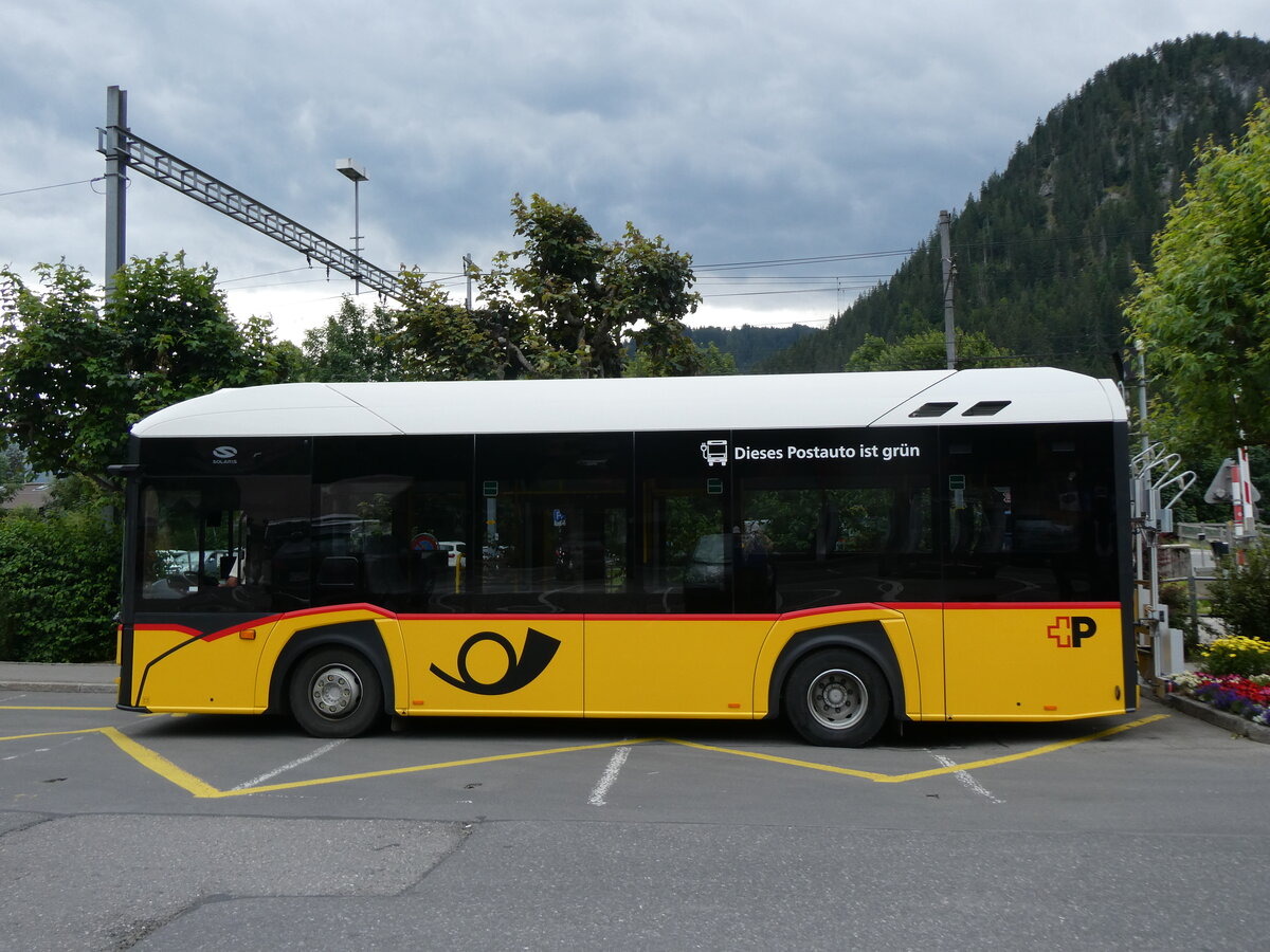 (264'349) - PostAuto Graub�nden - GR 162'994/PID 12'082 - eSolaris am 6. Juli 2024 beim Bahnhof Saanen