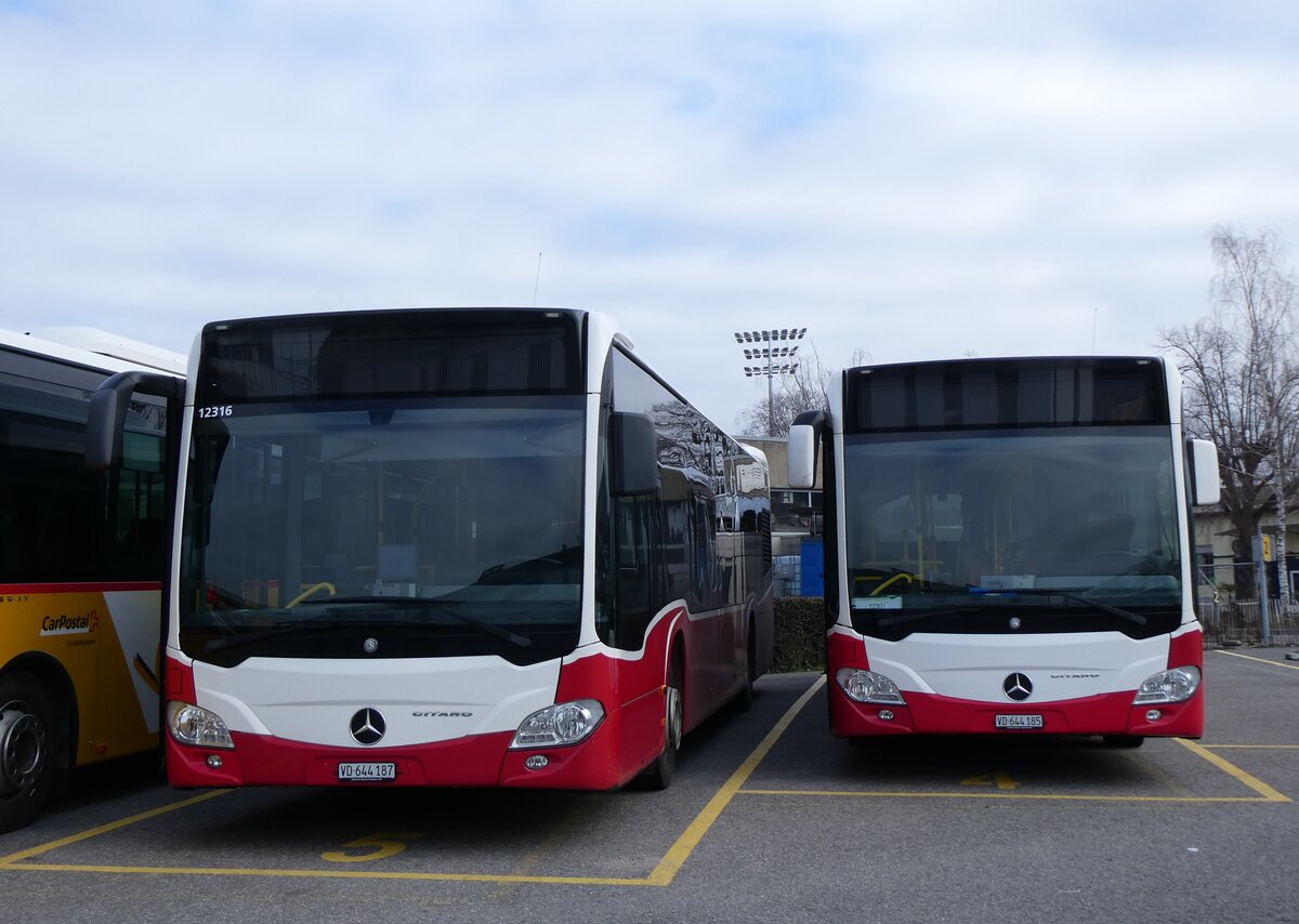 (271'593) - CarPostal Ouest - VD 644'187/PID 12'316 - Mercedes (ex Breuss, A-Rankweil; ex Wiener Linien, A-Wien Nr. 8133) + VD 644'185/PID 12'301 - Mercedes (ex Intertours, Domdidier Nr. 486; ex Wiener Linien, A-Wien Nr. 8122) am 1. Februar 2025 in Yverdon, Garage