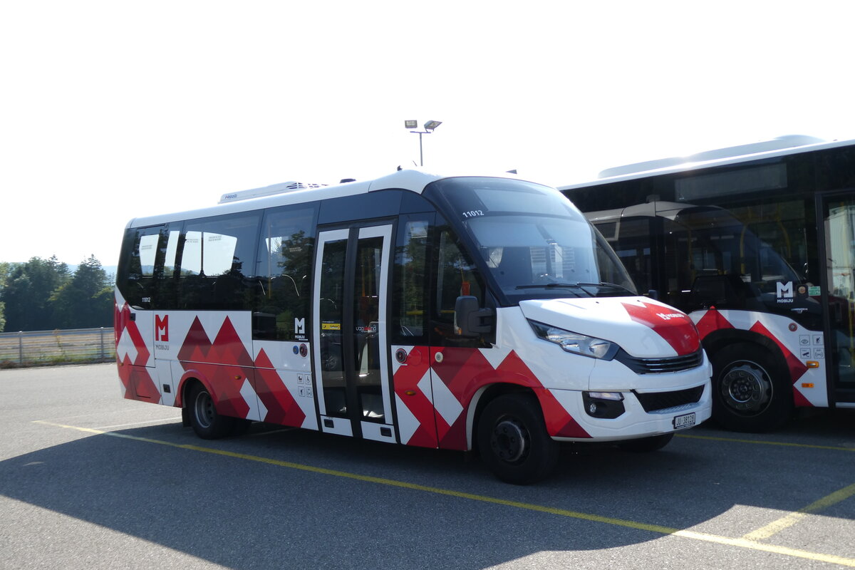 (278'709) - CarPostal Ouest - JU 38'128/PID 11'012 - Iveco/Rosero (ex Froidevaux, Charmoille) am 9. August 2025 in Develier, Parkplatz