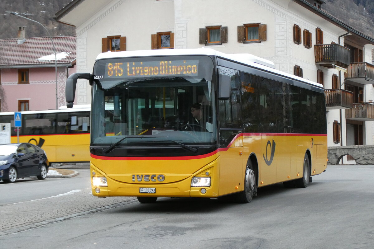 (284'862) - PostAuto Graub�nden - GR 102'393/PID 10'377 - Iveco (ex PostAuto Ostschweiz TG 158'065; ex PostAuto Graub�nden GR 170'438; ex PostAuto Ostschweiz AR 14'863) am 14. Februar 2026 beim Bahnhof Zernez