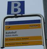(231'965) - PostAuto-Haltestellenschild - N�fels-Mollis, Bahnhof - am 10.