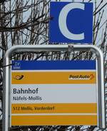 (231'969) - PostAuto-Haltestellenschild - N�fels-Mollis, Bahnhof - am 10.
